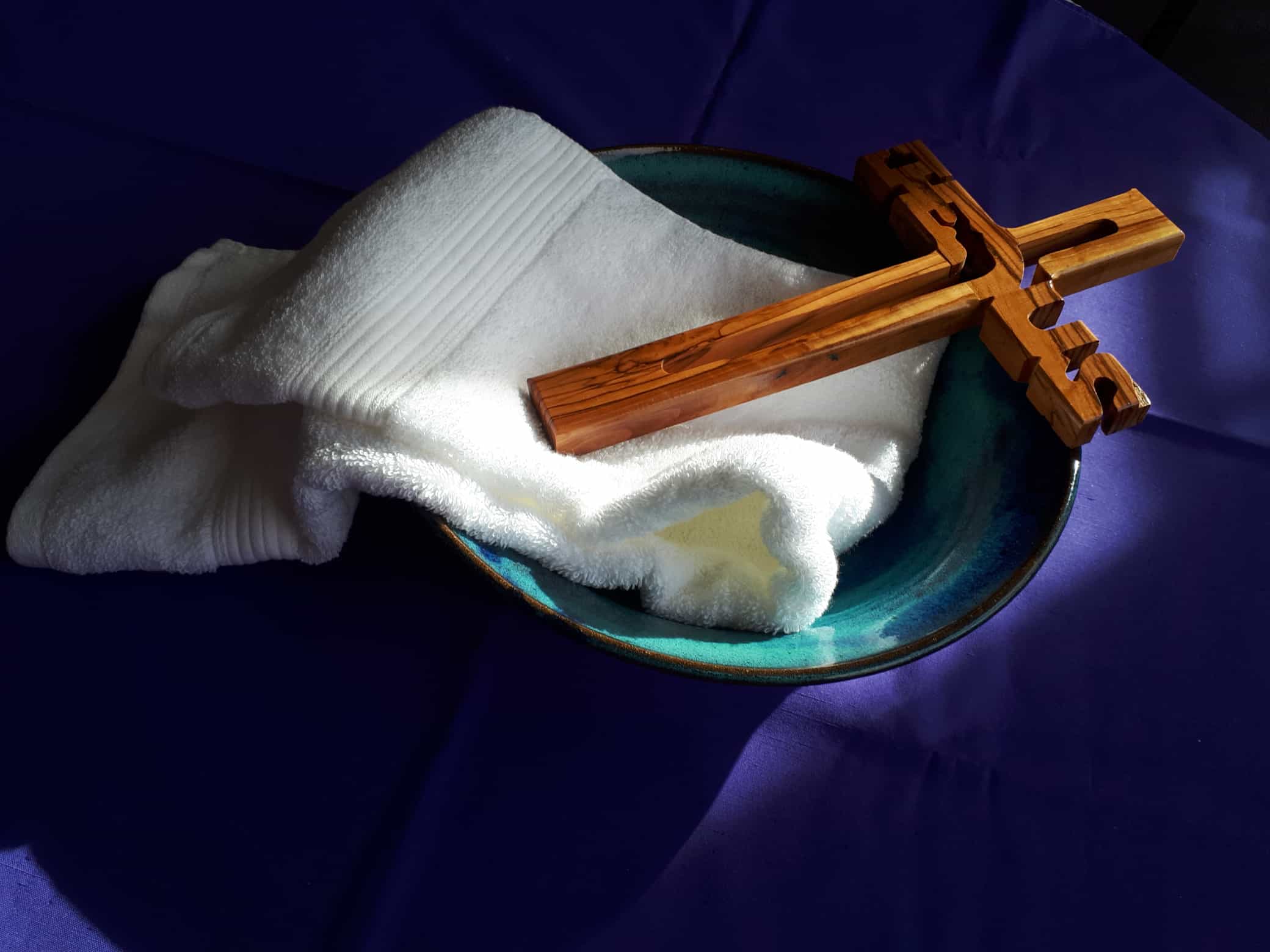 Towel and cross in bowl
